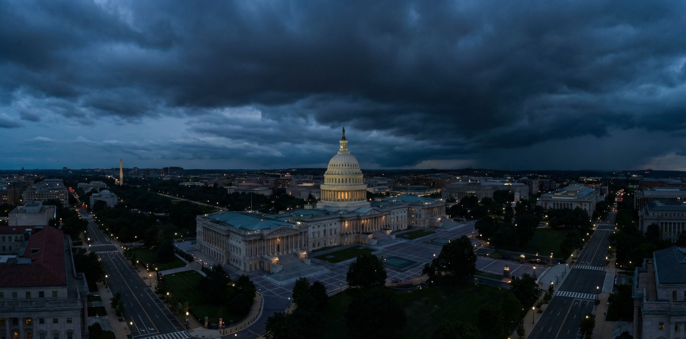 Aerial view of the U.S. Capitol building complex at dusk, dark dramatic sky, Washington D.C. government architecture
