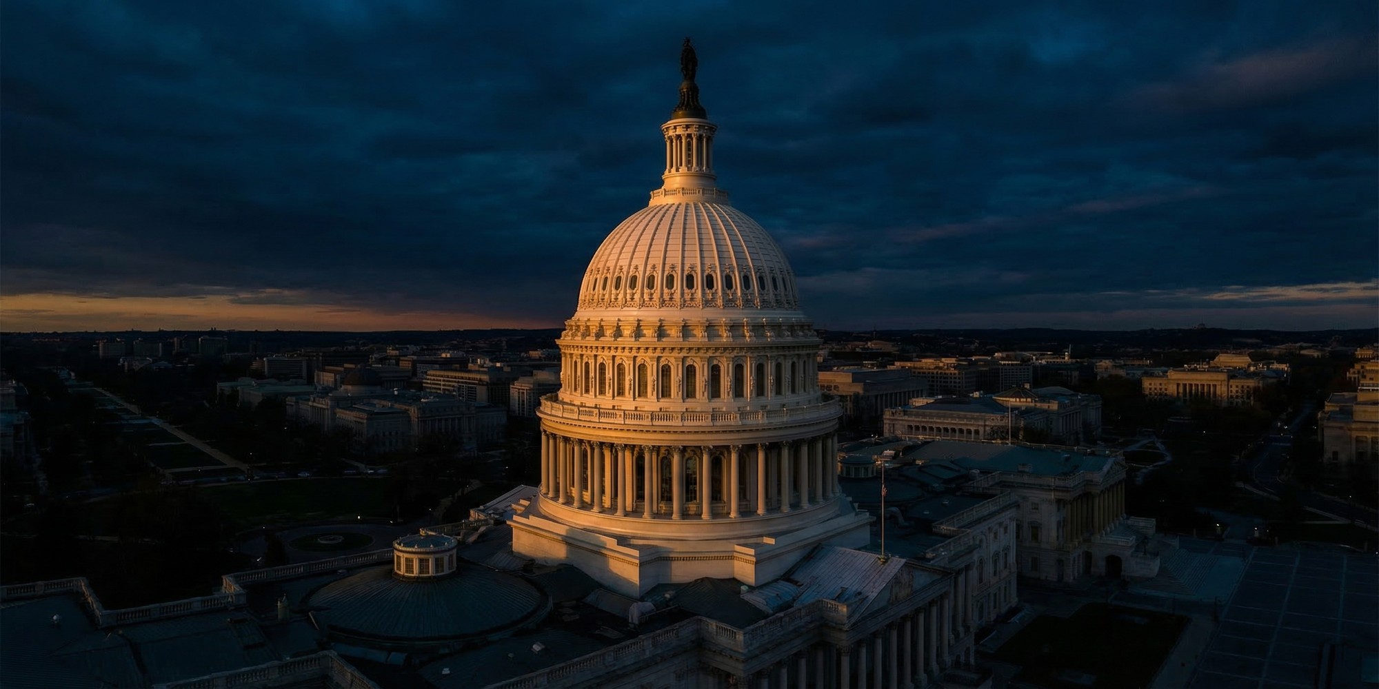 Aerial view of the United States Capitol building dome at dusk, representing the congressional vote on Public Law 119-21, the One Big Beautiful Bill Act